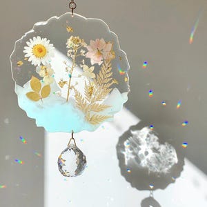 Suncatcher made of resin and dried flowers, soothing and relaxing interior decoration, art object